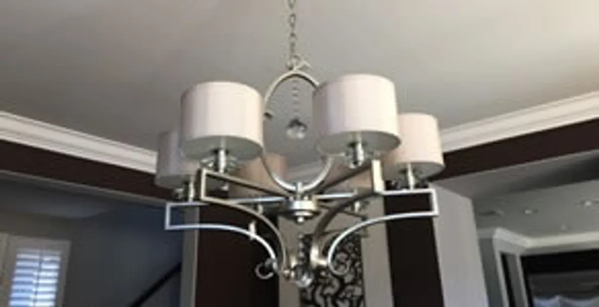 Modern chandelier installation with multiple light fixtures in Long Beach, CA